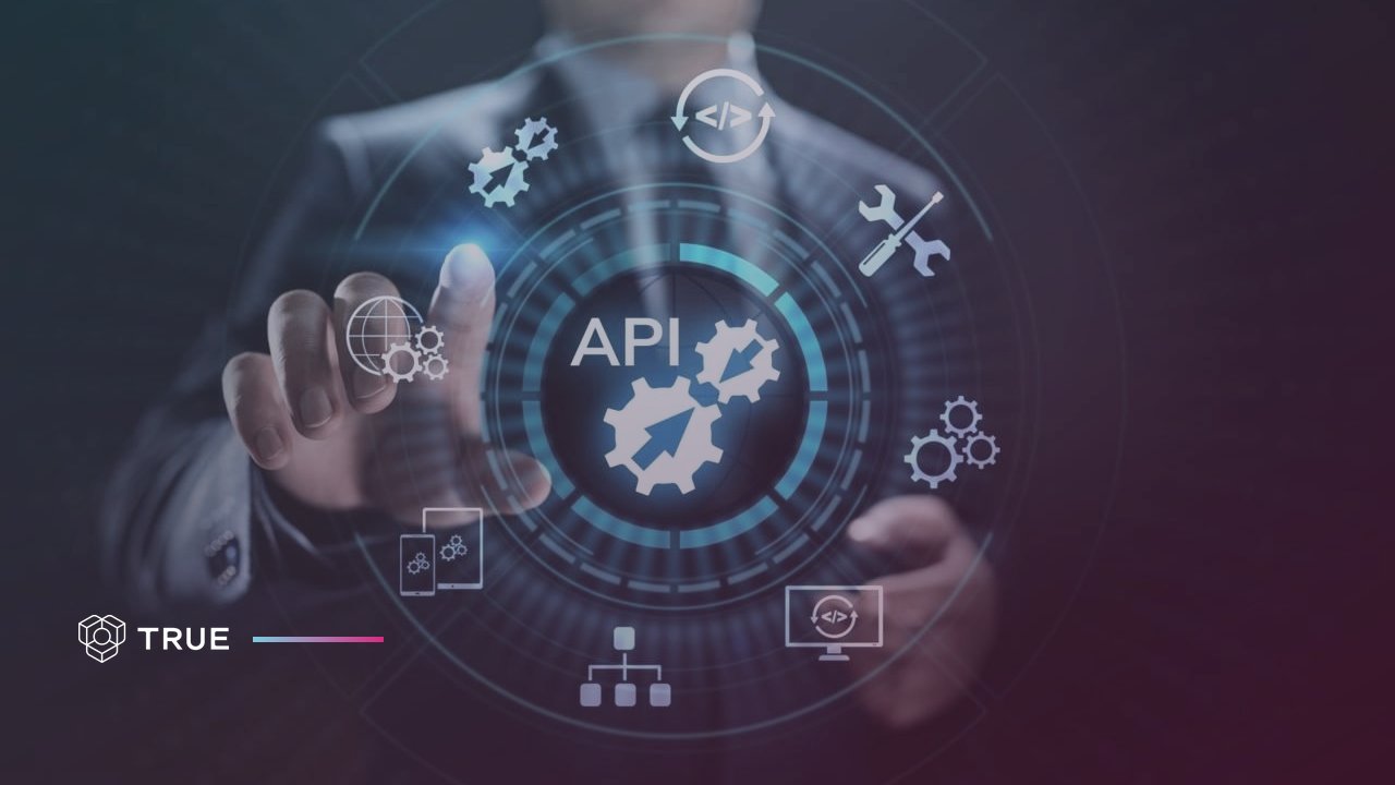 Certificate API: a hand touching a glowing API icon surrounded by gear, code and integration symbols, with the TRUE logo