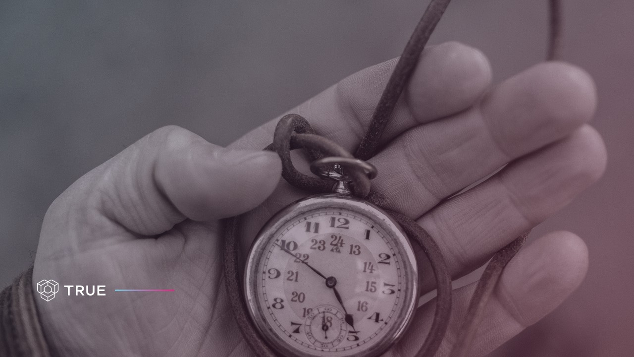an antique pocket watch in an open hand, the kind of item sold with a certificate of authenticity that transfers to the buyer