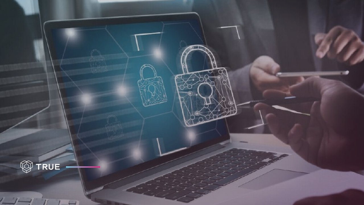 Laptop screen with digital padlocks linked in a network, illustrating how W3C verifiable credentials are secured with cryptography
